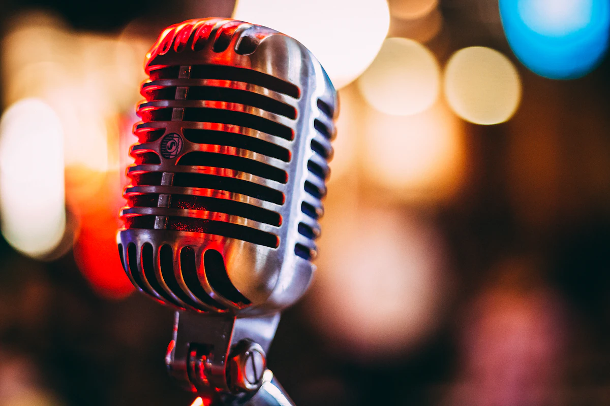 bokeh photography of condenser microphone — A hosted antakshari, bride’s side versus groom’s