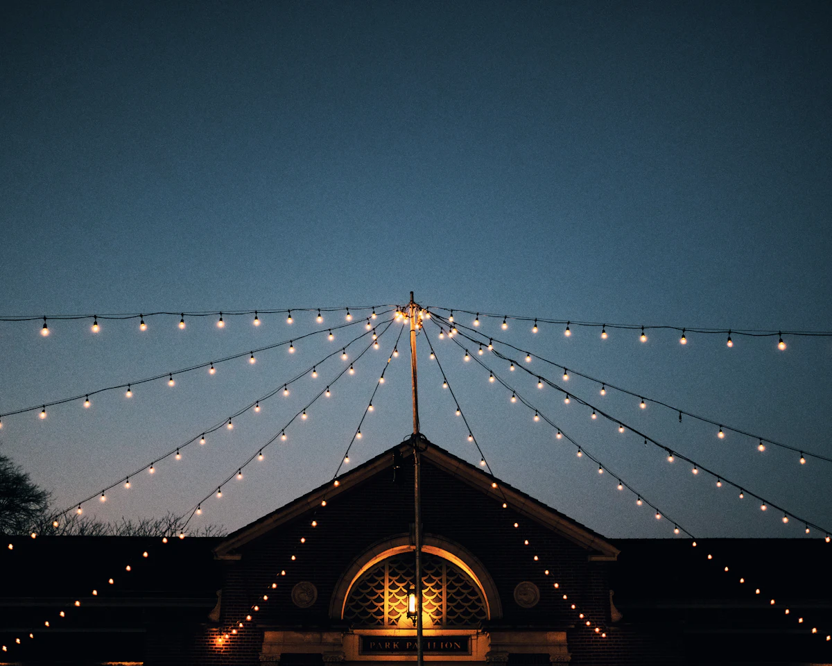 lights above house under blue sky at dawn — Spend on lighting before you spend on flowers