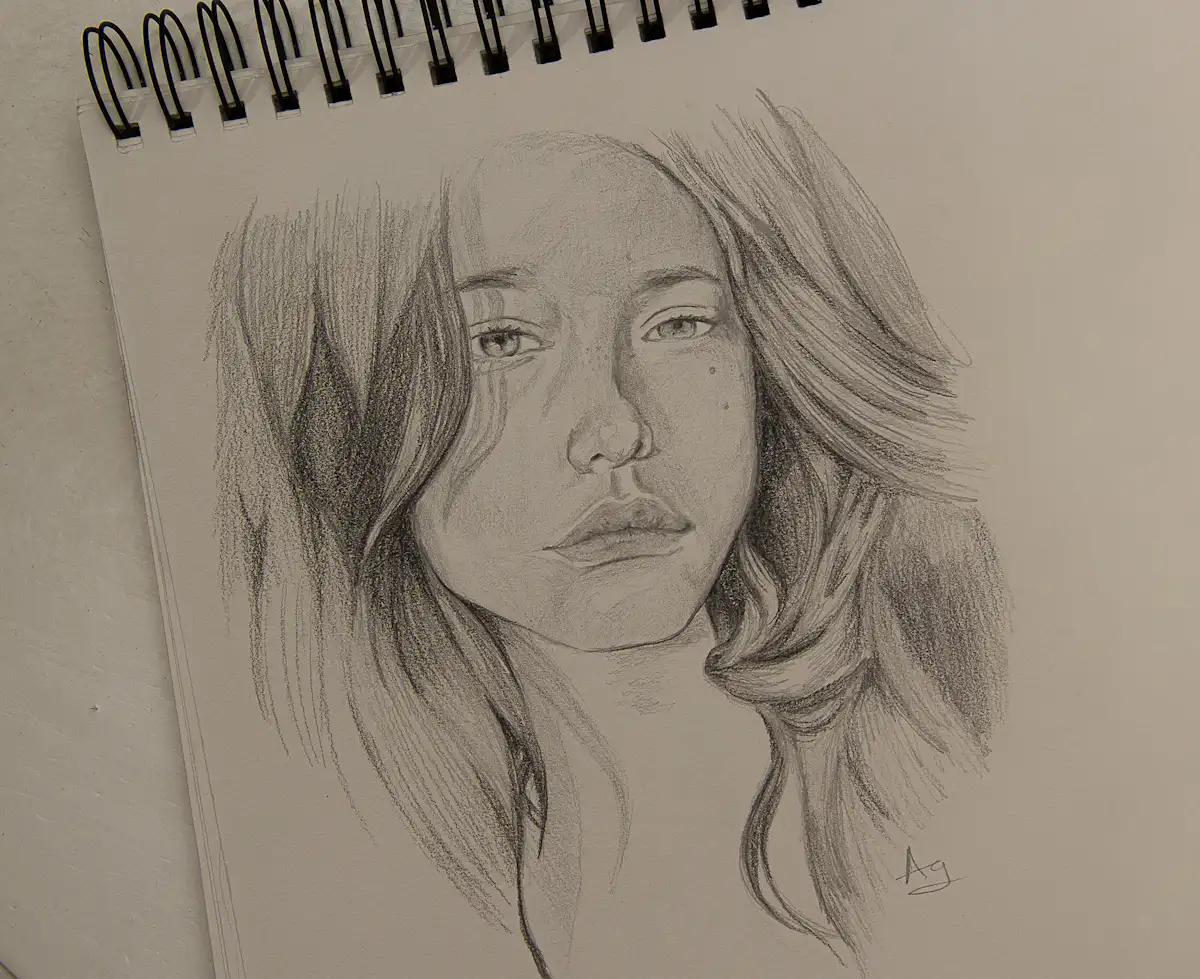 womans face sketch on white paper — A live portrait or caricature artist