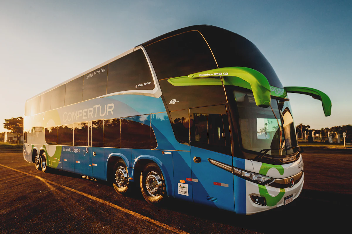parked blue and black Compertur bus — A shuttle loop instead of individual cars