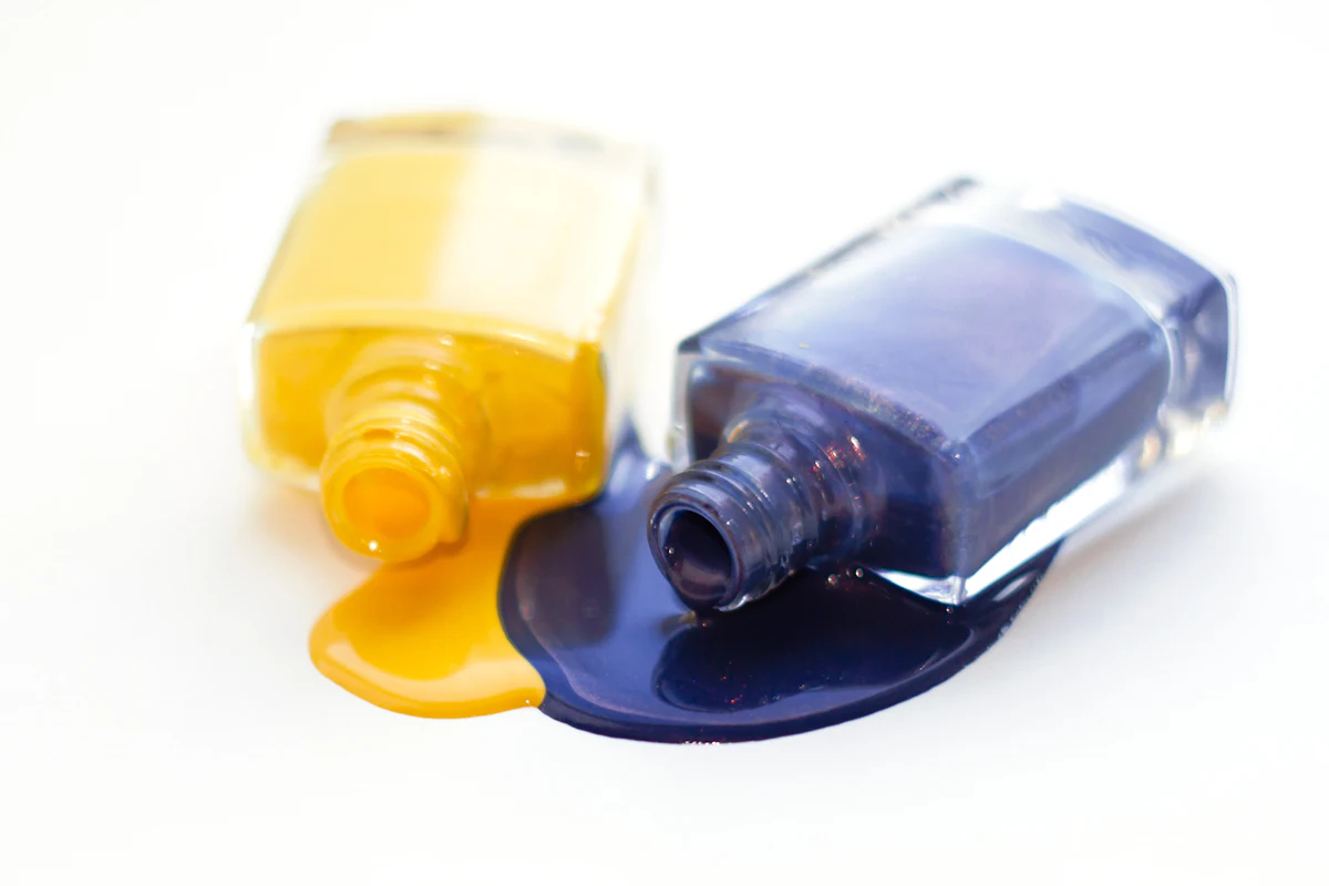 a bottle of yellow and blue nail polish — Temporary tattoo and nail bars