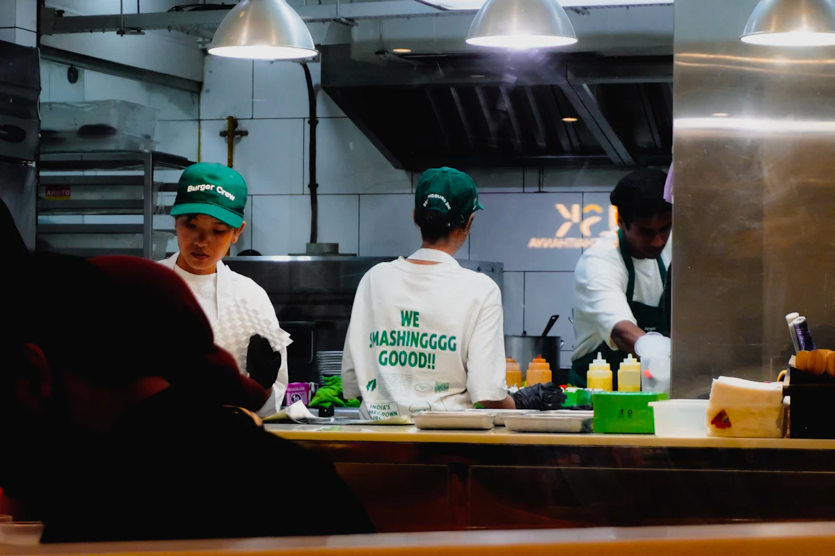 Restaurant staff preparing food in a professional kitchen — Feeding the vendors properly
