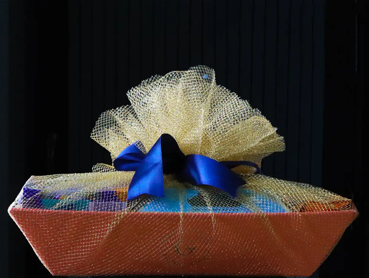 A basket with a blue bow on top of it — Welcome hampers, sorted by guest rather than by budget